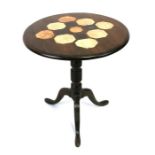 A mahogany tripod table, the top inset with specimen stones, 64cms (25ins) diameter.