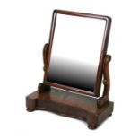 A Victorian figured mahogany toilet mirror with single frieze drawer, 57cms (22.5ins) wide.