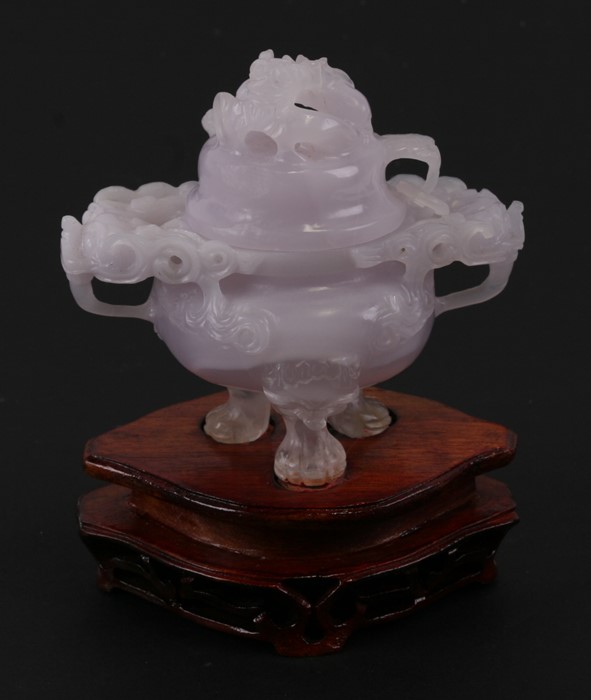 A Chinese lavender hardstone censer on three lion mask legs, 10cms (4ins) high.