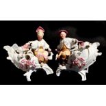 A pair of 19th century German bisque figures in the Chinese style with 'nodding' hands, 19cms (7.