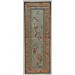 A Chinese silk embroidered panel depicting figures in a landscape, 23 by 63cms (9 by 24.75ins).