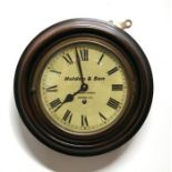 A Holden & Son mahogany cased wall clock, 30cms (12ins) diameter.