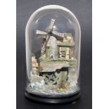 A musical automaton of a windmill with waterwheel, housed under a glass dome, overall 35cms (13.