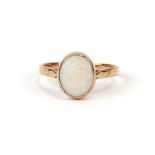 A 9ct gold ring set with an oval opal cabochon, approx UK size 'O'. 2.9g