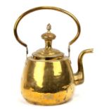 A large brass kettle, 37cms (14.5ins) high.