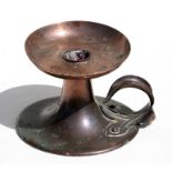 An Art Nouveau copper chamberstick, RD no. 27853, 9cms (3.5ins) high.