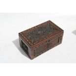 A carved oak jewellery box, 26cms (10.25ins) wide.
