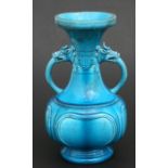 A Chinese turquoise glaze two-handled vase, 25cms (9.75ins) high.Condition ReportGood condition