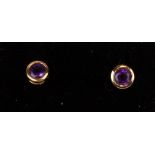 A pair of 18ct gold amethyst stud earrings.