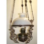A Malaccan ceramic hanging fuel ceiling lamp with white ceramic shade and font with chains for