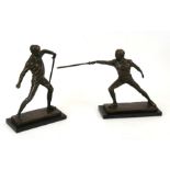 A pair of bronze figures depicting fencers, the largest 29cms (11.5ins) high (2).