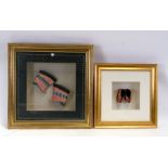 Four pairs of Chinese silk embroidered ladies shoes; two sets mounted in glazed display cases.