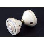 An early 19th century turned ivory whistling diablo, 8.5cms (3.25ins) wide.