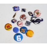 A quantity of enamel and tin badges to include London Transport and other motor related badges.