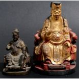 A Chinese gilded wooden figure, a Dignitary seated on a throne, 22cms (8.5ins) high; together with a