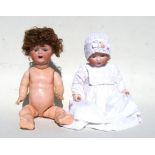 An Armand Marseille bisque headed doll with composite body, sleeping eyes and open mouth, stamped