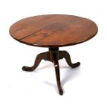 A Georgian oak tripod table, 74cms (29ins) diameter (reduced in height).