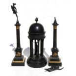 A 19th century Grand Tour style garniture consisting of two bronze and marble columns surmounted