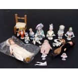 A group of porcelain pin cushion dolls, the largest 10cms (4ins) high; together with other items.