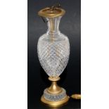 A gilt metal mounted cut glass table lamp, 40cms (15.75ins) high.