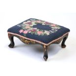 A chinoiserie lacquered footstool with needlepoint seat, 30.5cms (14ins) wide.Condition ReportGood