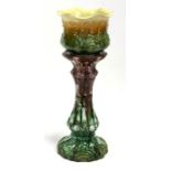 An Art Nouveau majolica jardiniere on stand, 74cms (29ins) high.Condition Report 2cm chip to the