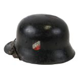 A WW2 Third Reich double decal helmet with liner and chin strap.