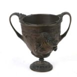 A Victorian two-handled bronze vase decorated in relief with centaurs, 15cms (6ins) high; together