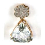 A 9ct gold pendant with a diamond set cluster above a large triangular clear stone, made by