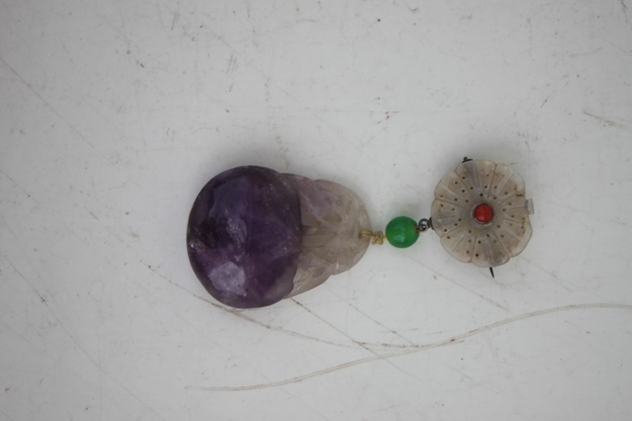 A Chinese jade flower brooch with carved amethyst peach drop, 9cms (3.5ins) high.Condition - Image 2 of 7