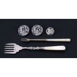 A silver and mother of pearl pickle fork, Birmingham 1895; together with another similar; and