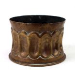 A WW1 trench art pot with fluted side made from a German 1911 brass shell case. Diameter at base