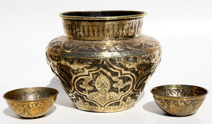 A Persian brass planter decorated with animals and figures, 23cms (9ins) high; together with two