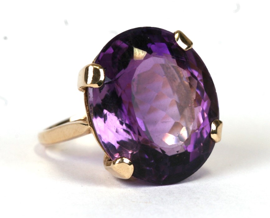 A 9ct gold cocktail ring set with a large amethyst, approx UK size 'N'. 9.5g