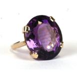 A 9ct gold cocktail ring set with a large amethyst, approx UK size 'N'. 9.5g