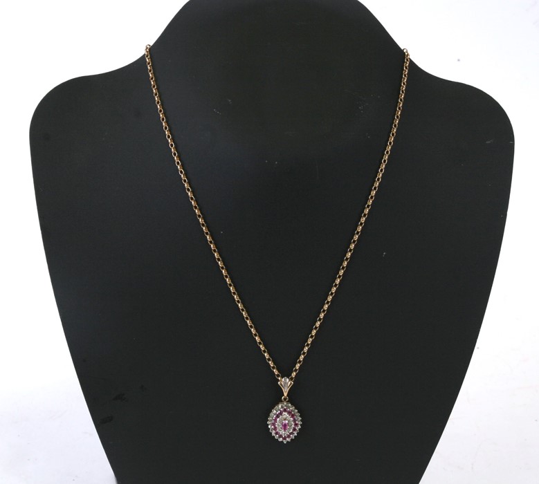 A 9ct gold ruby & diamond pendant on a 9ct gold belcher link chain. 8.8g