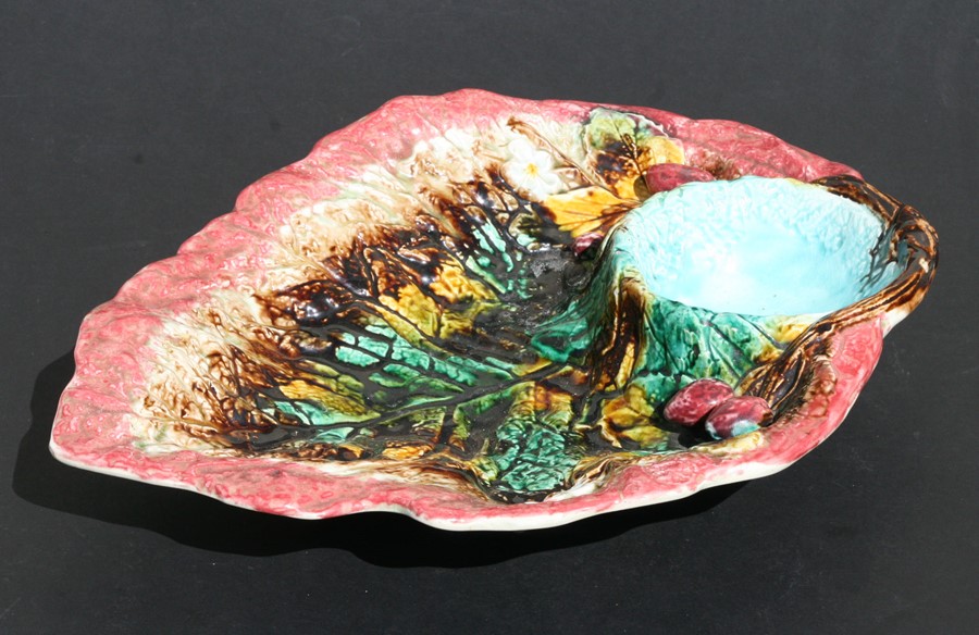 A 19th century majolica begonia leaf strawberry dish on four feet, impressed 'R' to the underside,