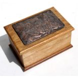 A mahogany box with applied copper plaque depicting a classical scene, 23cms (9ins) wide.