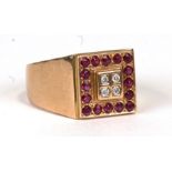 A large 9ct gold gentleman's ring set with four diamonds surrounded by rubies, approx UK size 'W'.