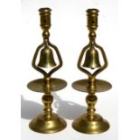 A pair of brass tavern candlesticks, 33cms (13ins) high.