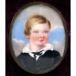 A portrait miniature depicting a young boy, mounted as a brooch in its original shaped and fitted