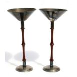 A pair of Austrian Hammercraft silver plated stands with turned mahogany columns, 24cms (9.5ins)