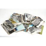 A quantity of loose postcards.