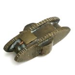 A WW1 solid brass trench art Tank with copper machine guns. Overall length 9cms (3.5ins)