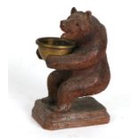 A Black Forest bear ashtray,14cms (5.5ins) high.