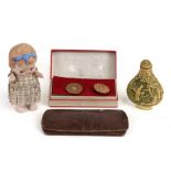 A Dinky Do miniature porcelain doll; together with a Chinese snuff bottle; a pair of novelty