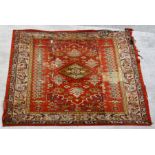 A large Turkish hand knotted woollen Ushak carpet with repeated geometric pattern 579 by 366cms (