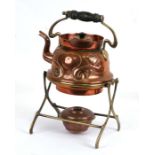 An Art Nouveau copper & brass spirit kettle on stand, 30cms (12ins) high.