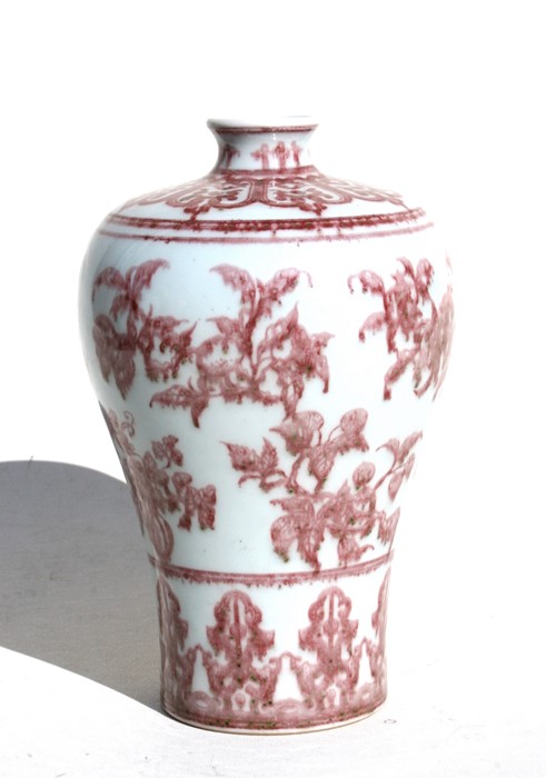 A Chinese underglazed copper red Meiping vase decorated with flowers, 26cms (10.25ins) high.
