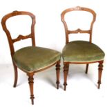 A pair of late 19th century inlaid occasional chairs with upholstered seats, on turned front